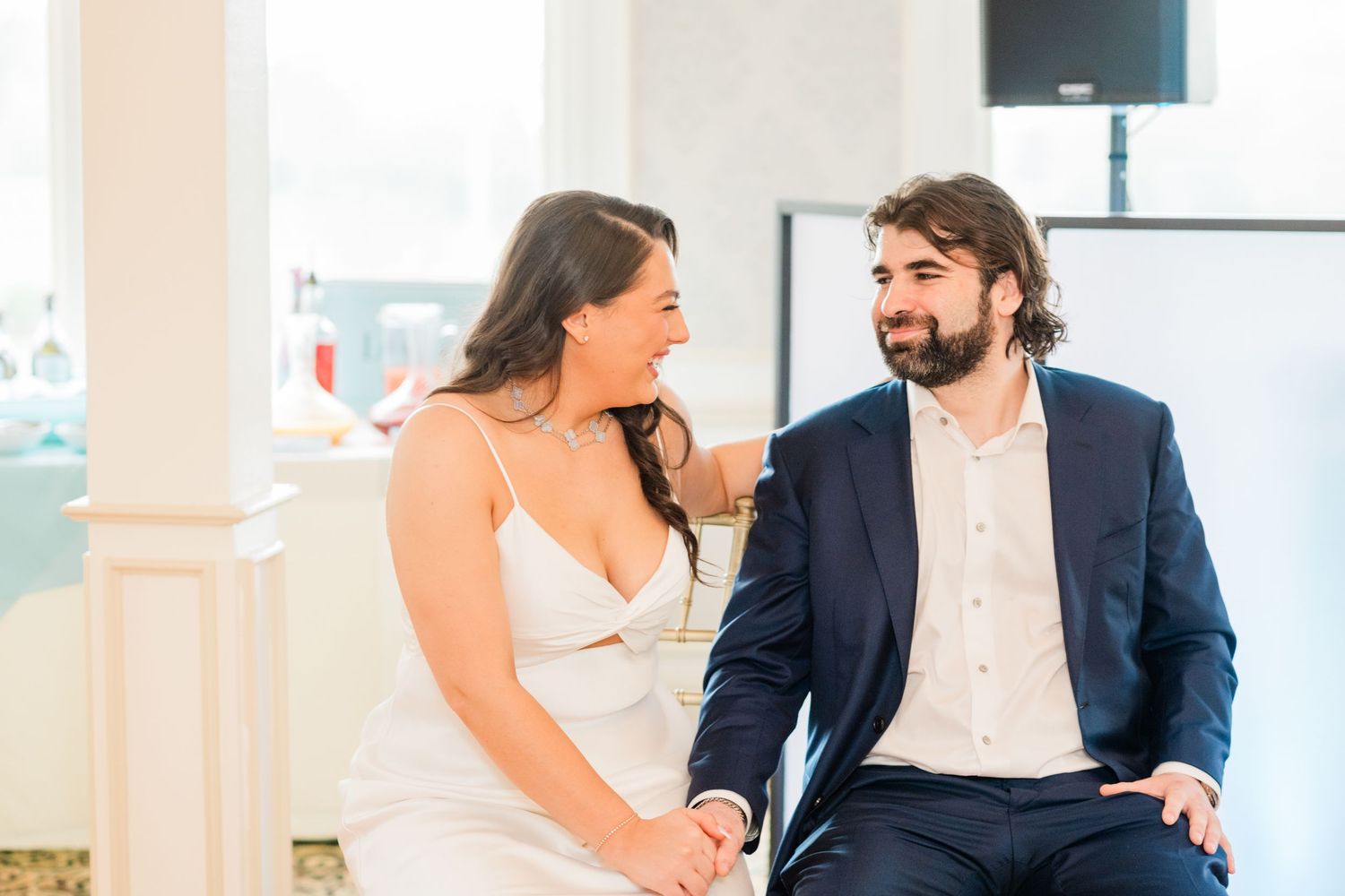 Couple sharing joyful moments during their wedding celebration.