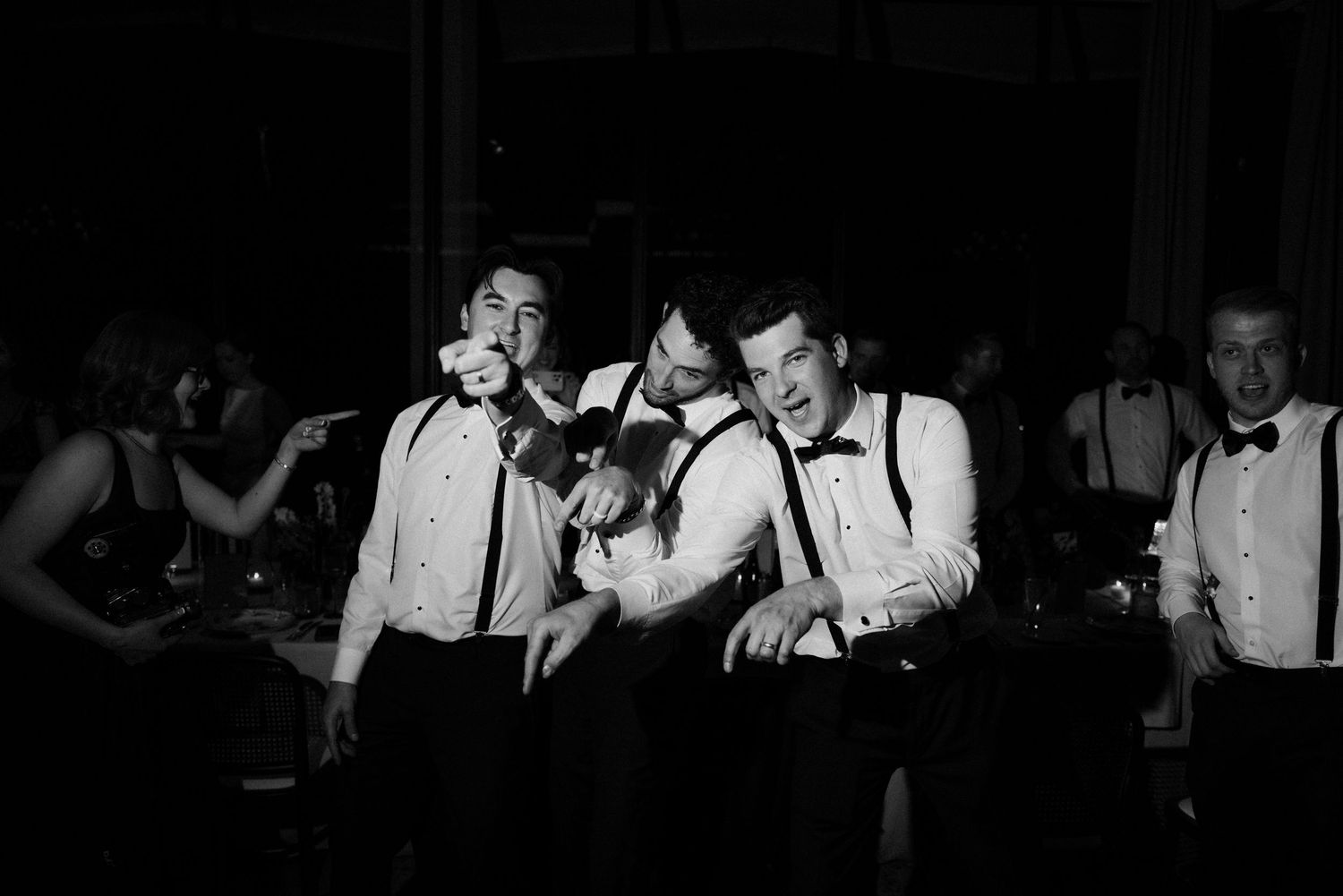 Multiple black and white photographs showing nightclub scenes with musicians performing in dark settings.