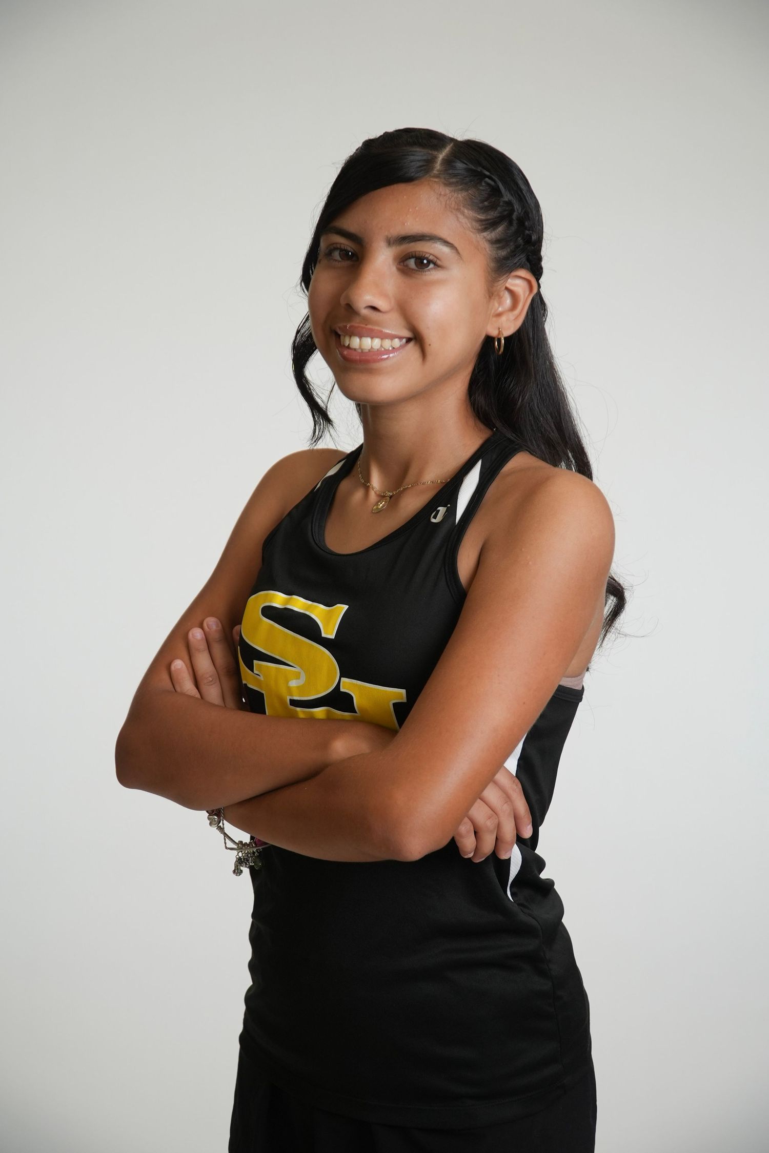 Female high school athlete posing for a sports team portrait in Fullerton, CA.
