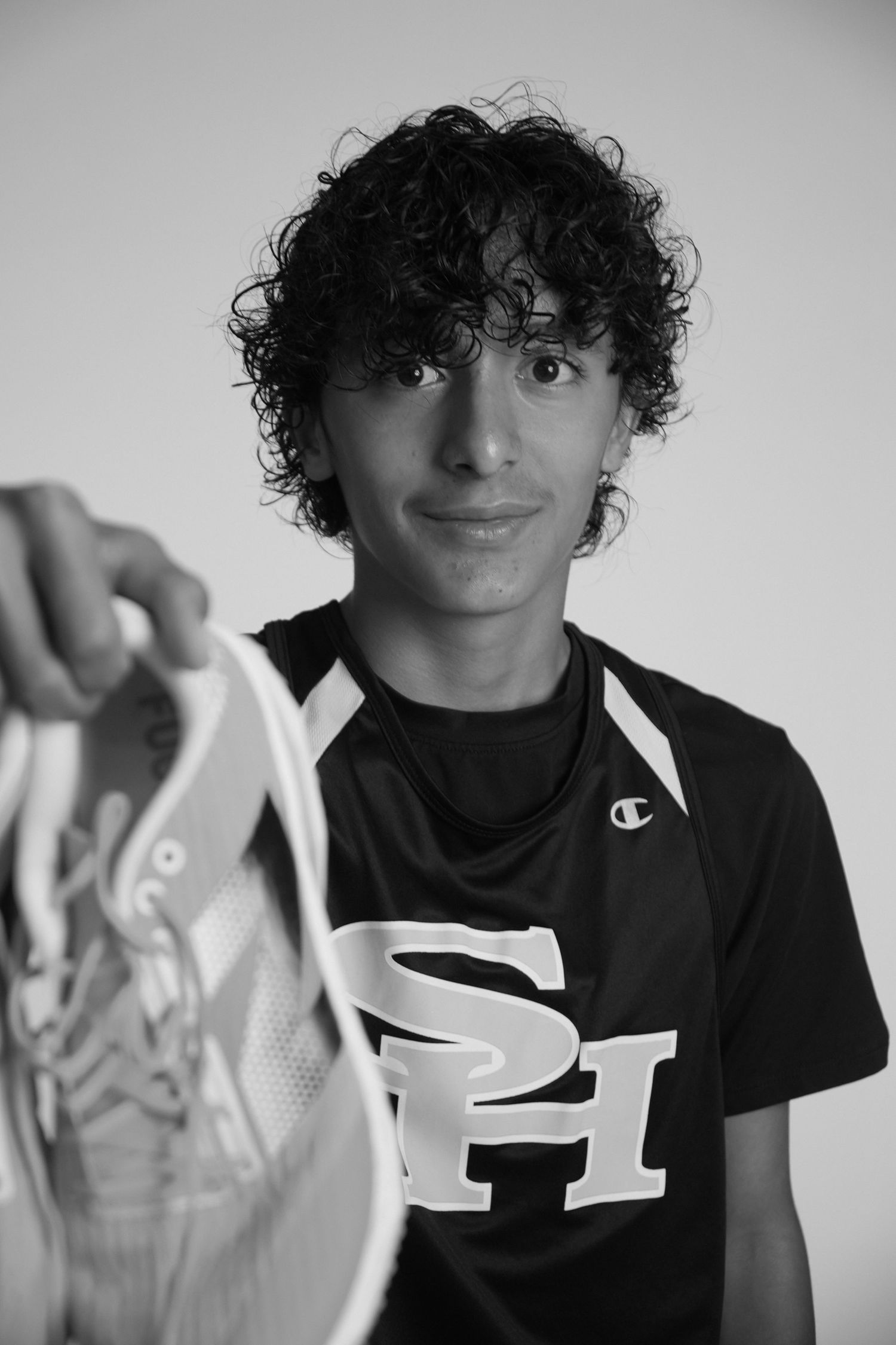 Male high school athlete posing for a sports team portrait in Fullerton, CA.