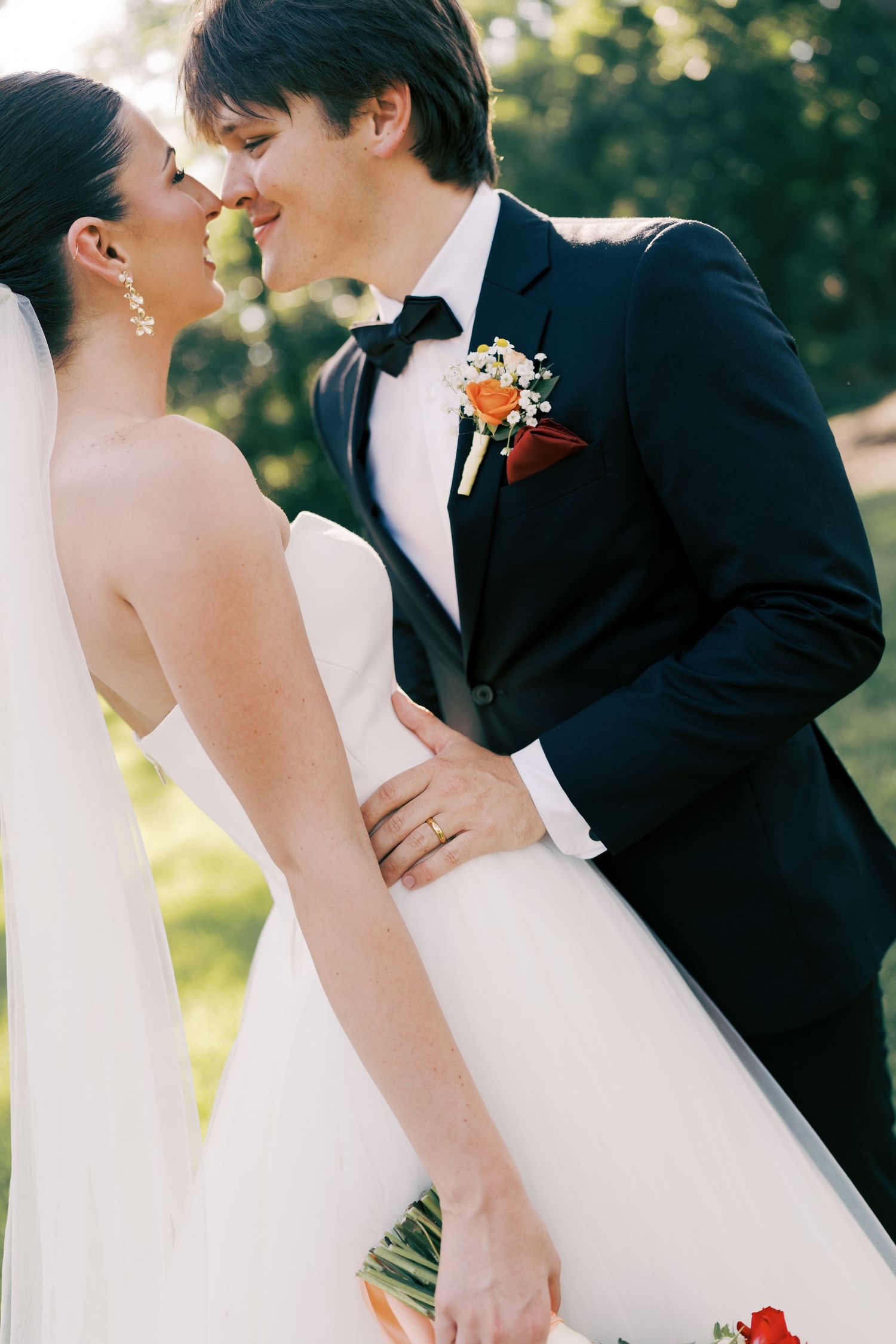 Romantic wedding couple portraits in natural sunlight.