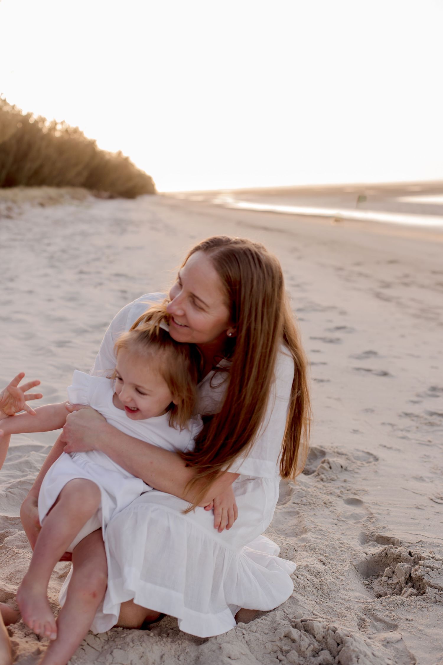 Candid beachside moment captured during golden hour.