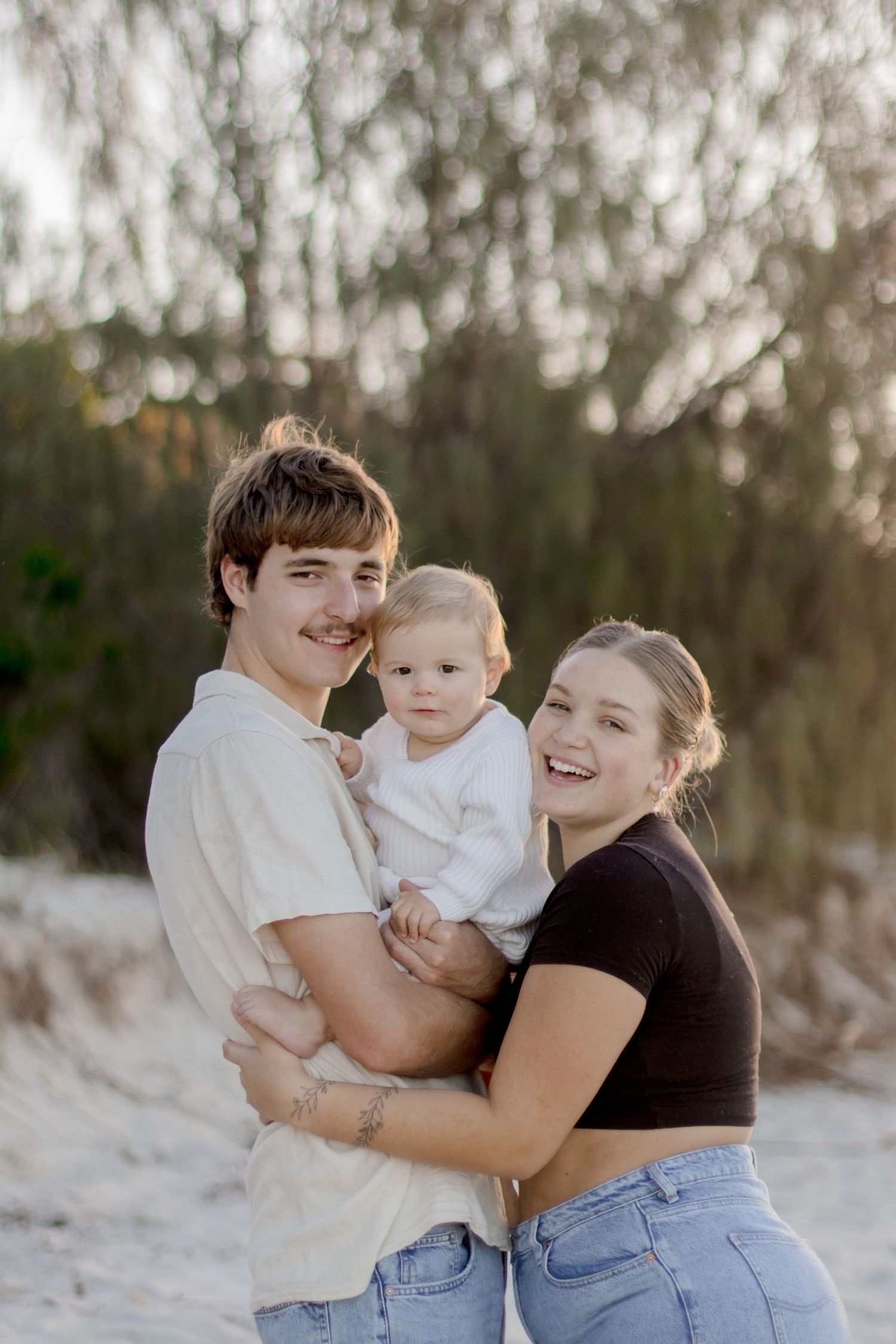 A candid series of photos showing joyful interactions between people sharing warm embraces against a natural outdoor backdrop.