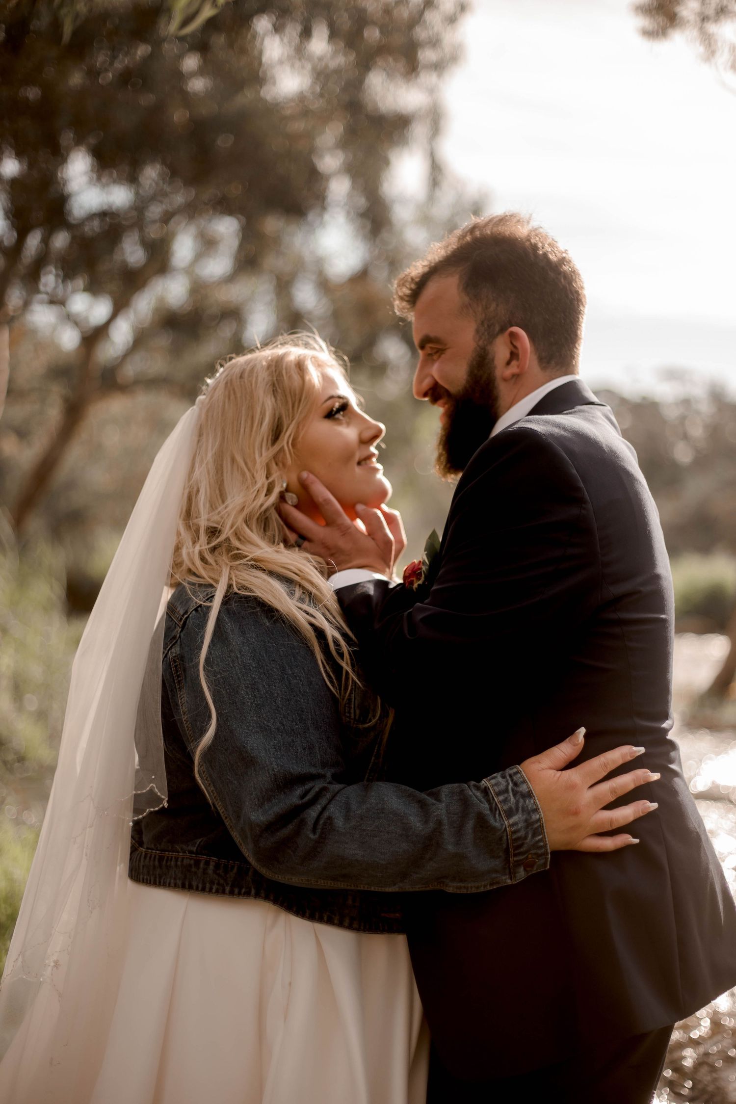 Four sequential photos show a couple in an intimate winter wedding embrace outdoors with bride wearing a veil and coat.