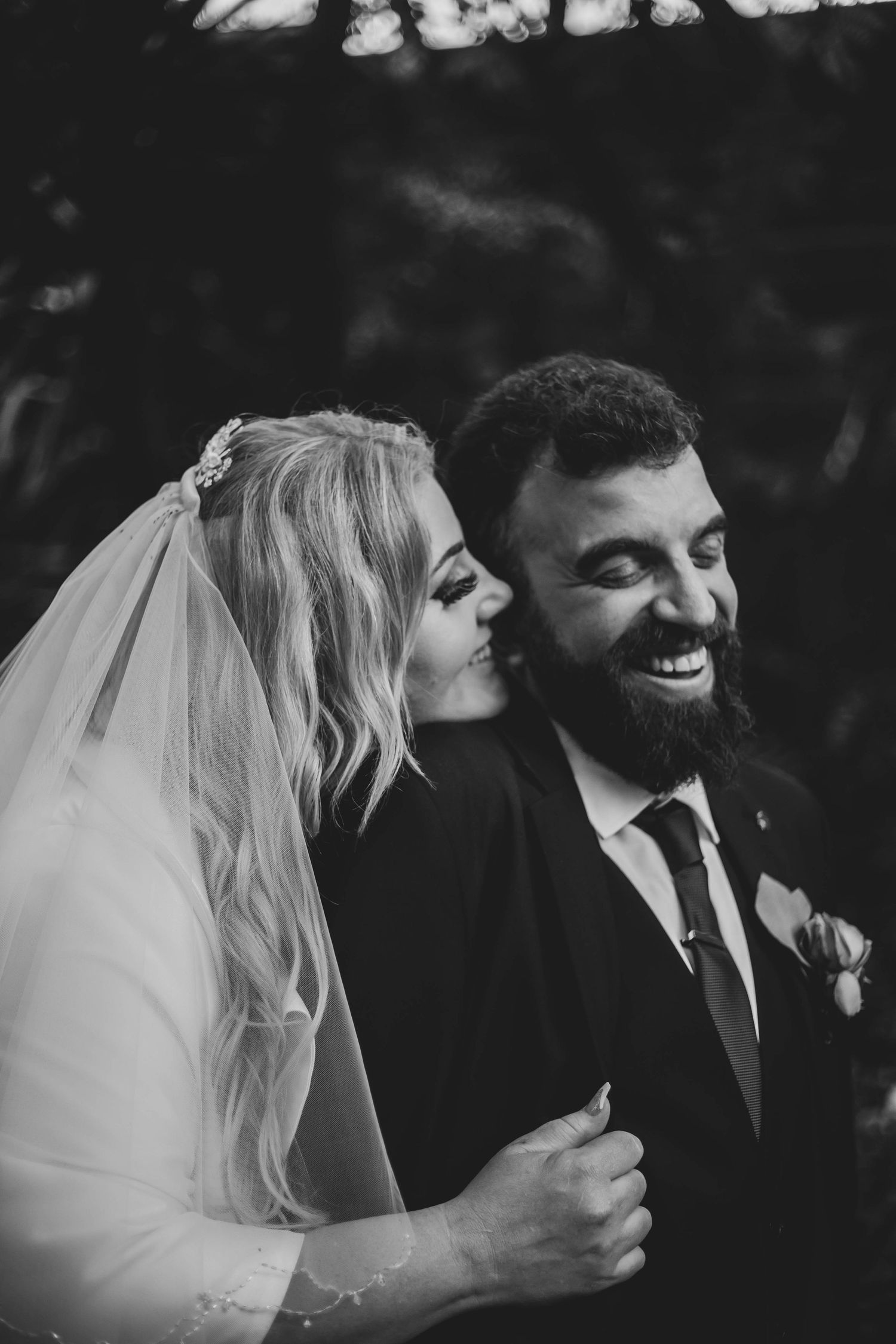 Black and white wedding photo sequence showing a tender laughing moment between a bride and groom.