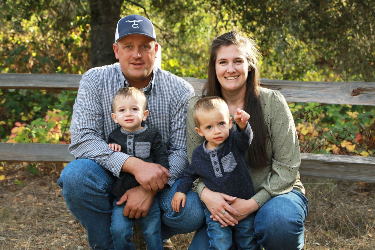 Family photo in Ragle Park Sebastopol CA in front of a wooden fence