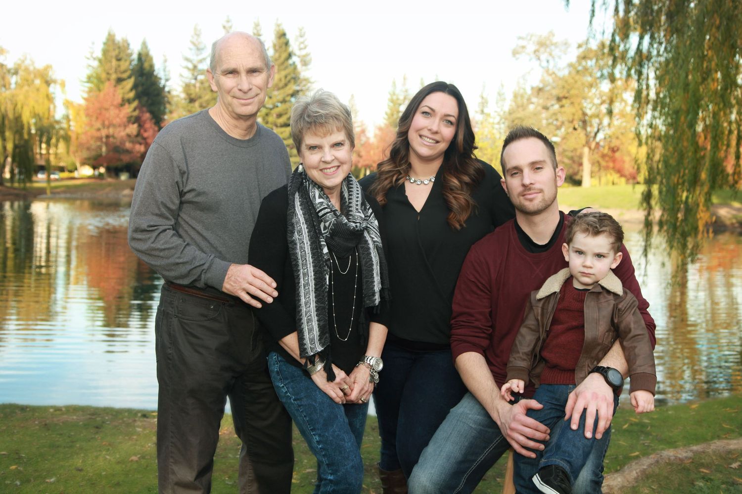 beautiful family with mirror like pond in background