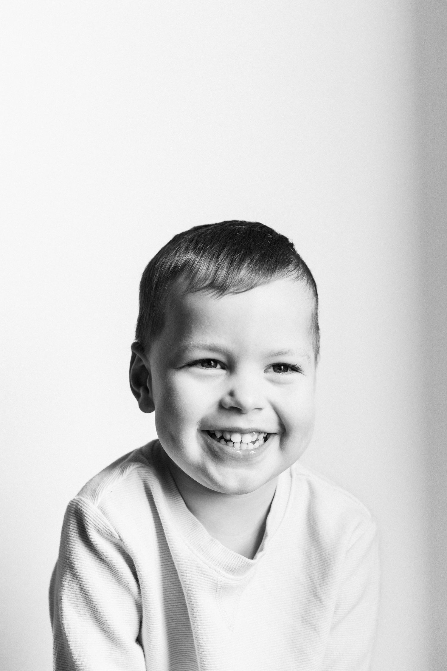 black and white toddler photo smiling