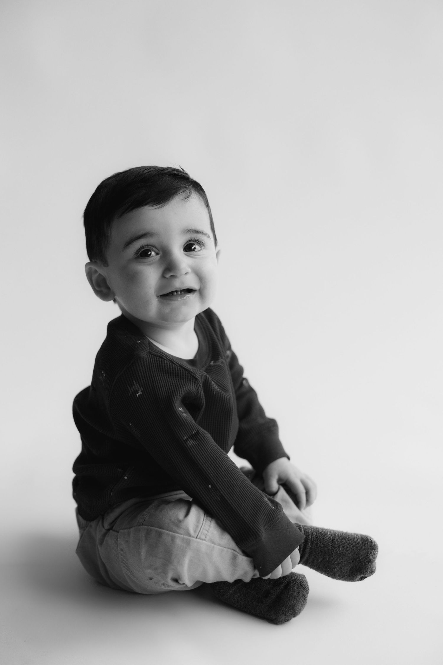 black and white toddler photo smiling