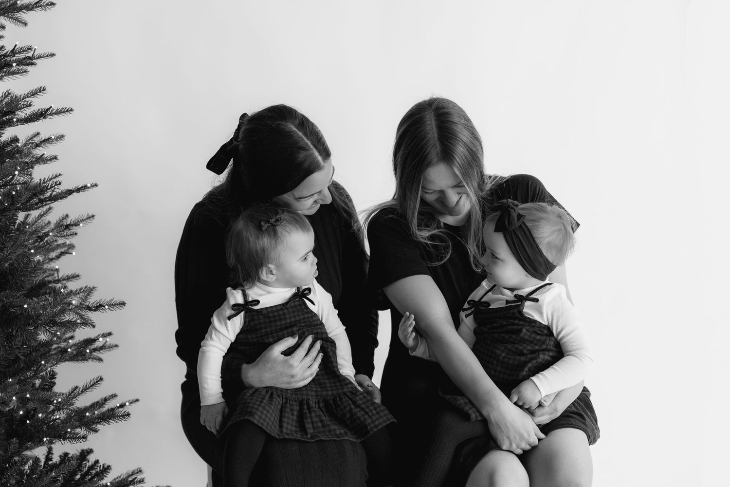 A collection of intimate black and white photographs showing tender embraces and emotional moments.