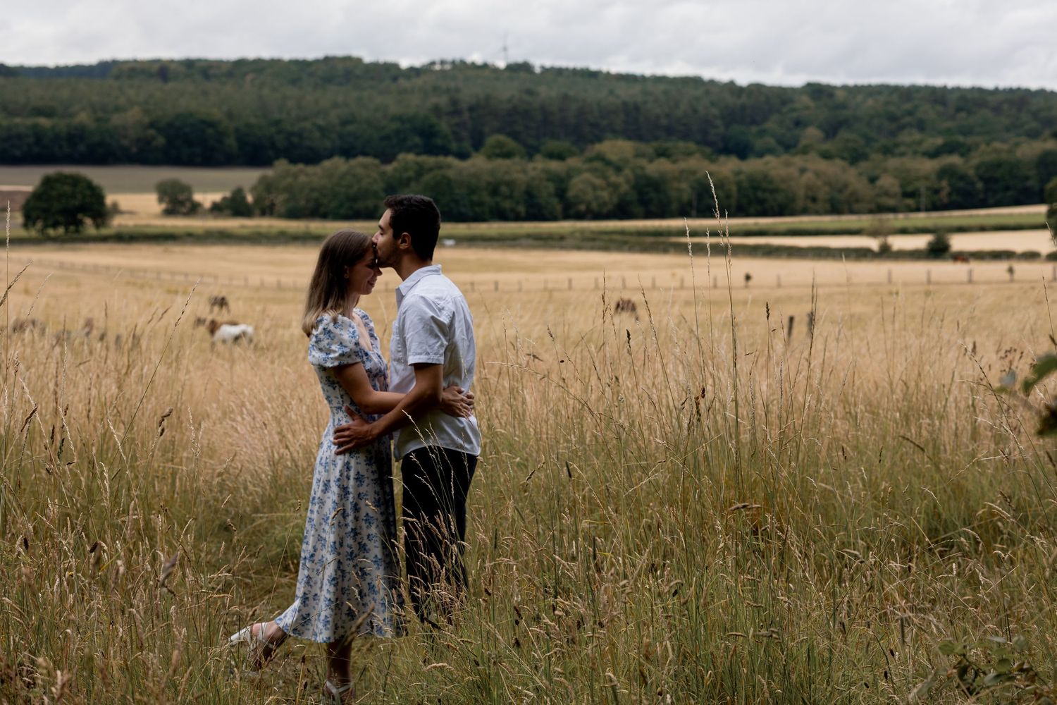 A couple walking and talking candidly during a couples session. Natural, documentary photography. Nottingham, Midlands.