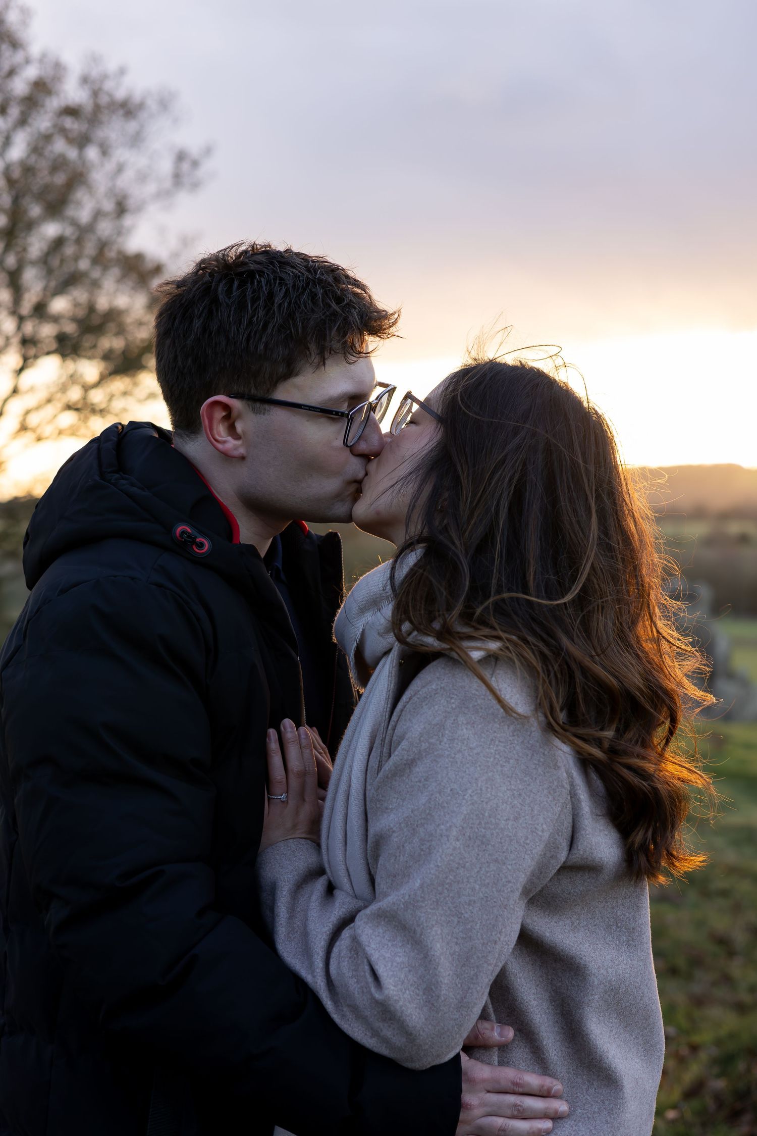 A couple during golden hour on their engagement shoot. Beautiful setting. Natural, documentary photography. Nottingham, Midlands.