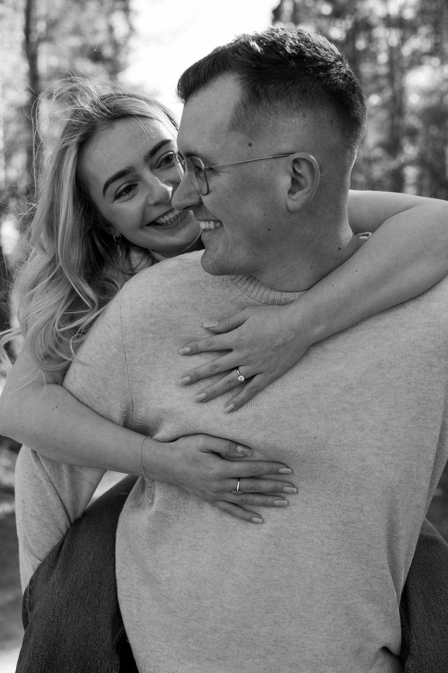 Laughter and natural lighting in the woods. Couples engagement shoot, Nottingham. The Midlands. Black and white.