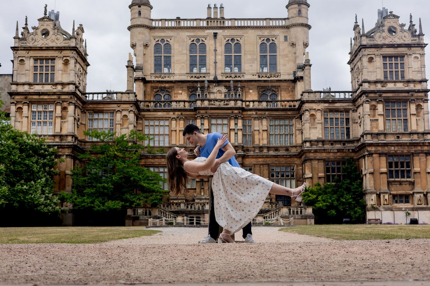 A dip kiss on an engagement shoot outside Wollaton Hall, Nottingham.