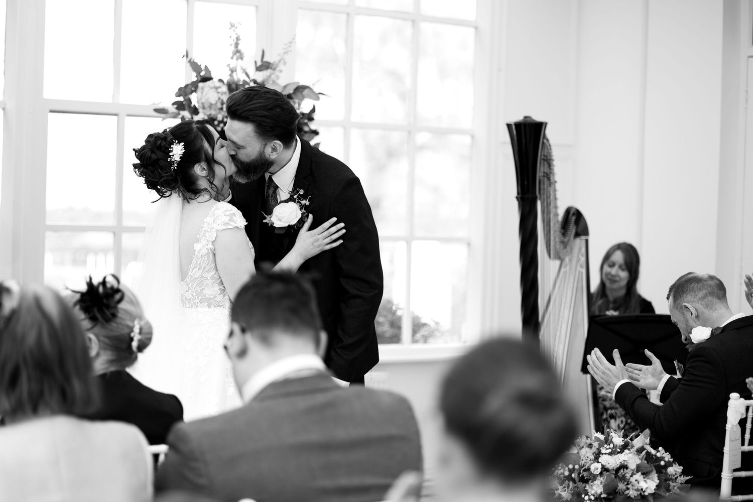 The first kiss. Couples first kiss during the ceremony. Black and white. Romantic. Natural documentary wedding photography