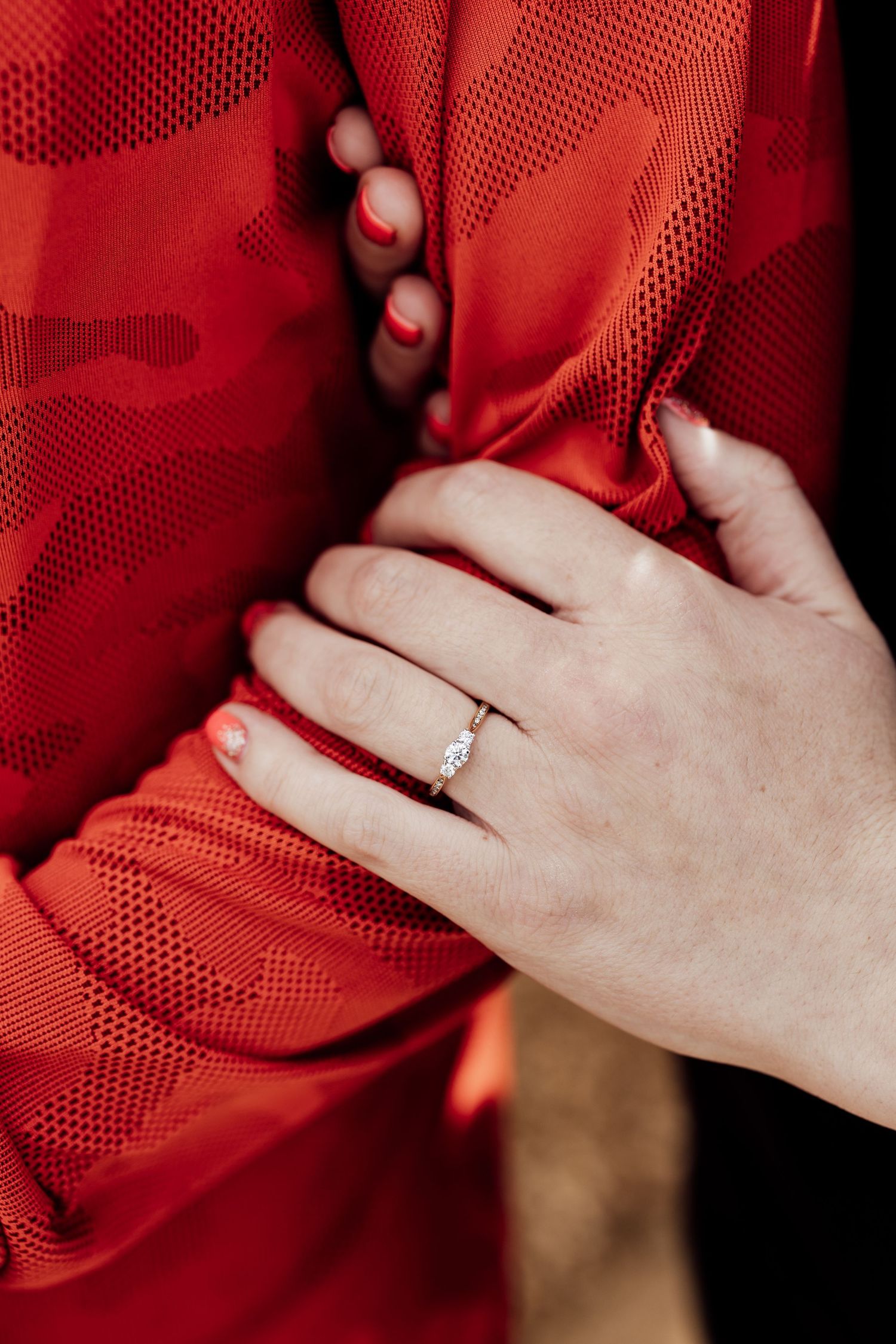 Newly engaged outside Normanton Church, Rutland. Close up shot of the engagement ring.