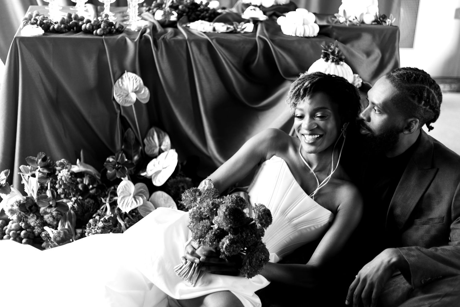 Relaxed couple by the dessert table smiling. Natural documentary wedding photography
