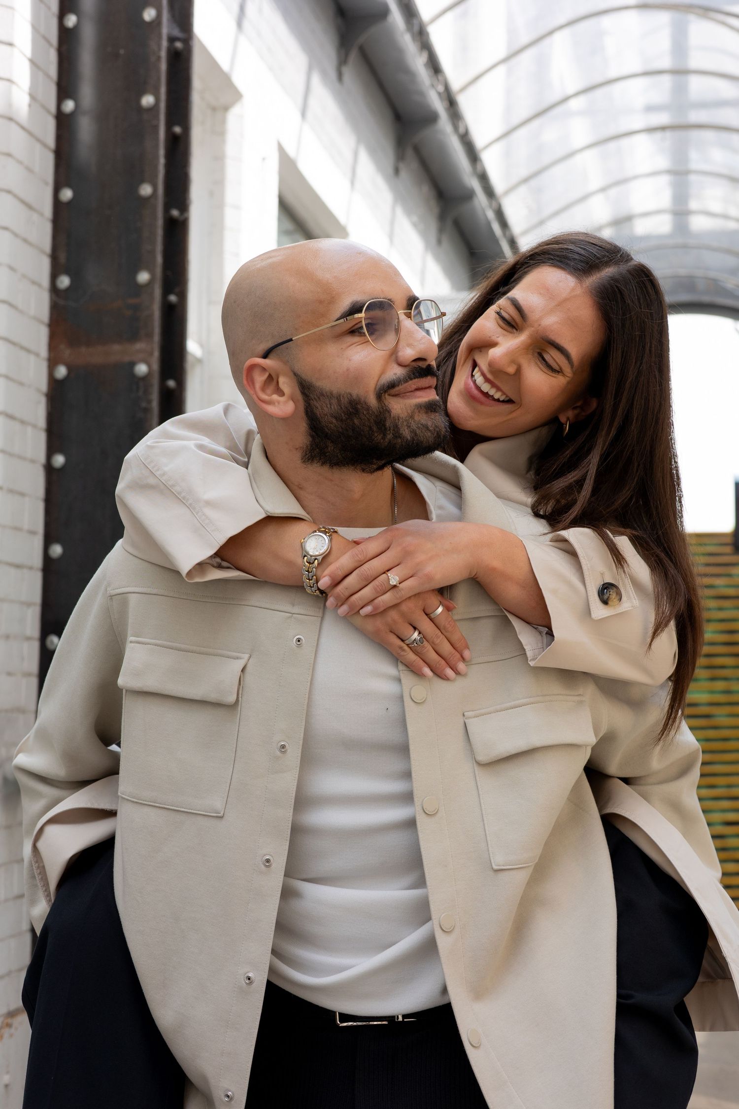 Piggy back! Couple looking at each other and smiling during a piggy back. Natural documentary wedding photography