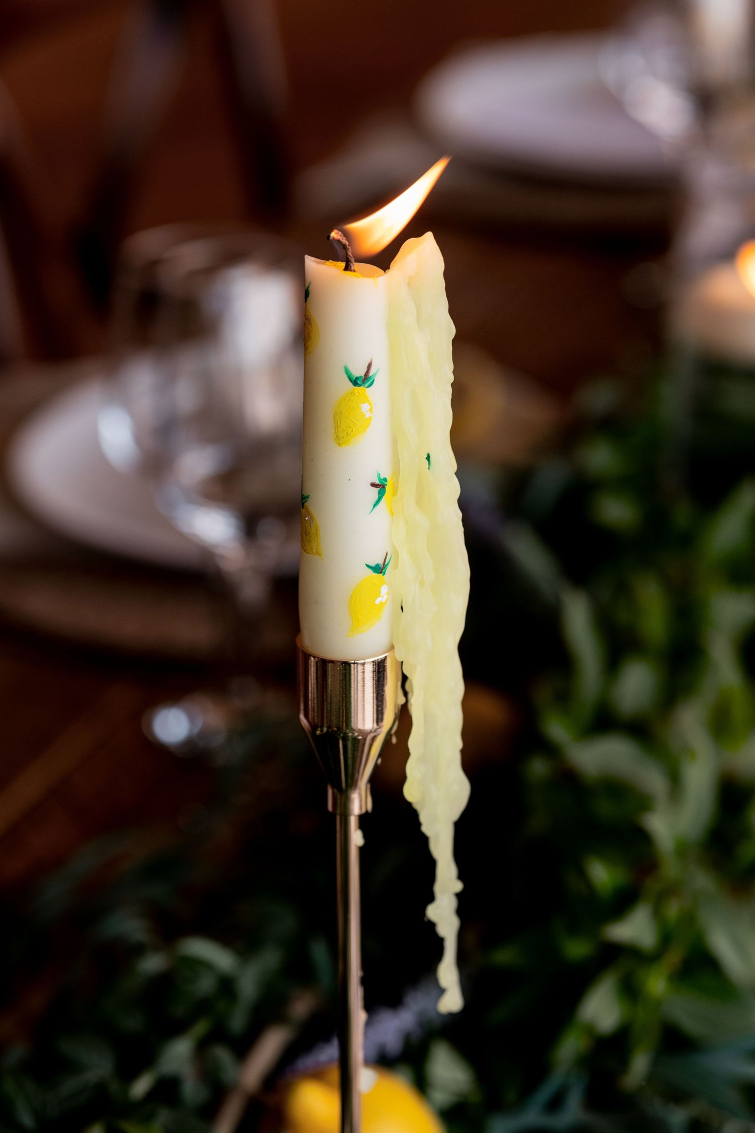 the wax melting later in the day of a hand painted tapered candle at The Fable Yard in the Midlands.