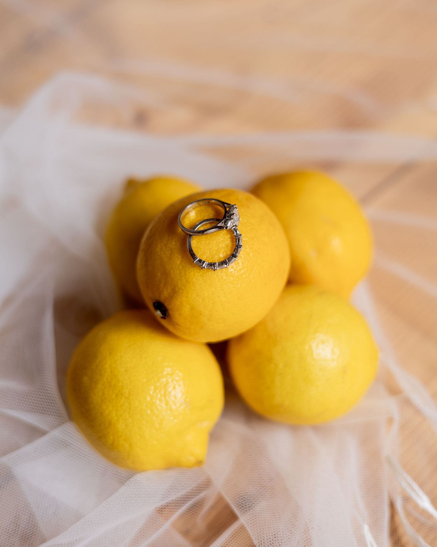 Wedding rings placed carefully on some lemons for zesty fun!