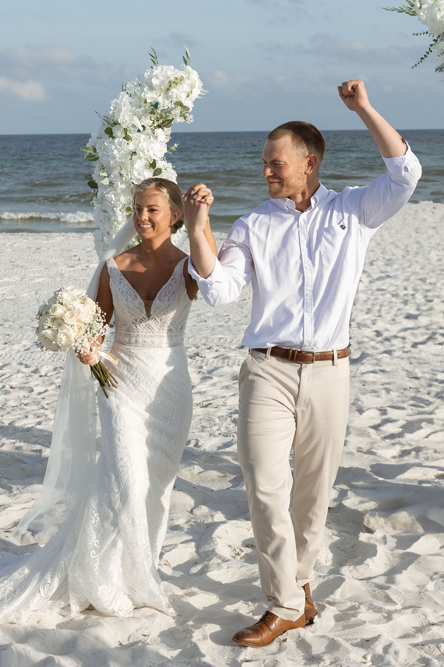 Candid couple portrait during Navarre Beach micro wedding with sandy shore