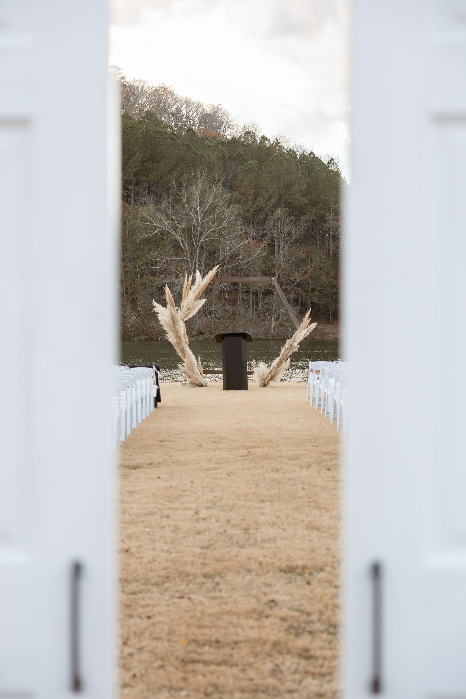 Lakefront wedding ceremony at Taylor Estate in Rome GA during late fall