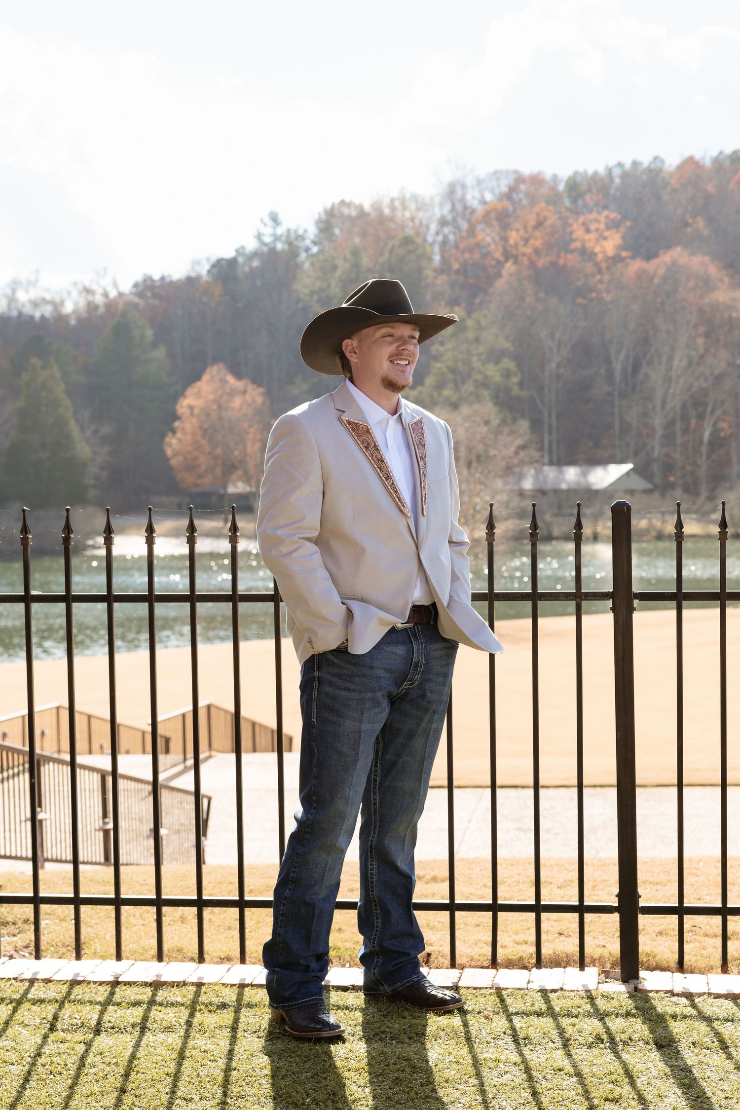 Groom wearing custom leather lapels during western-inspired wedding in Rome GA