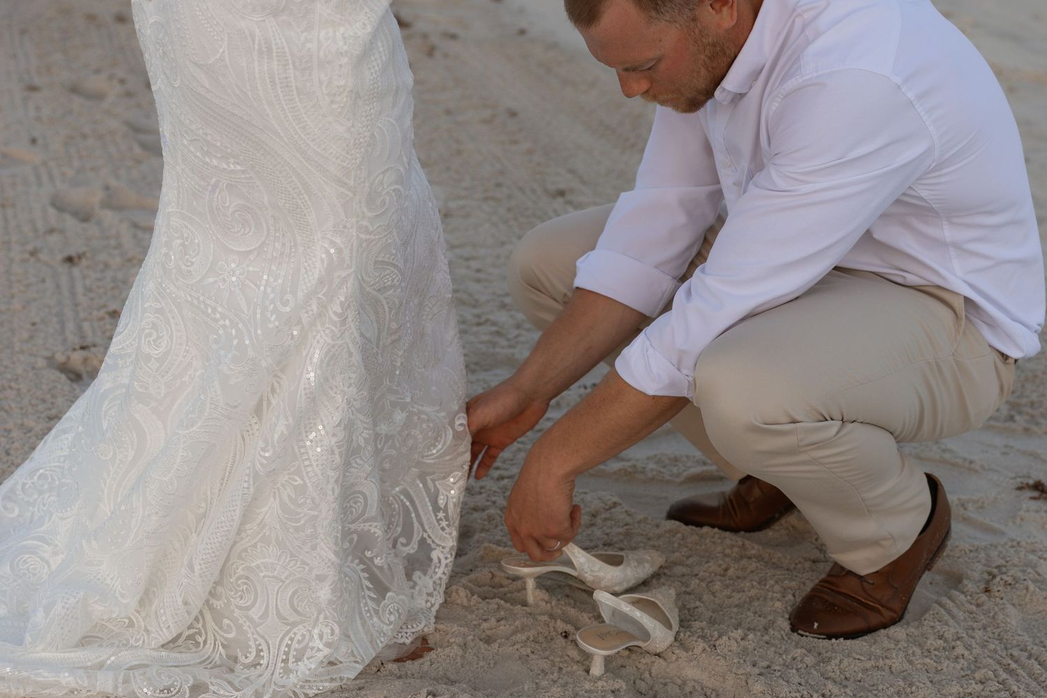 Candid couple portrait during Navarre Beach micro wedding with sandy shore