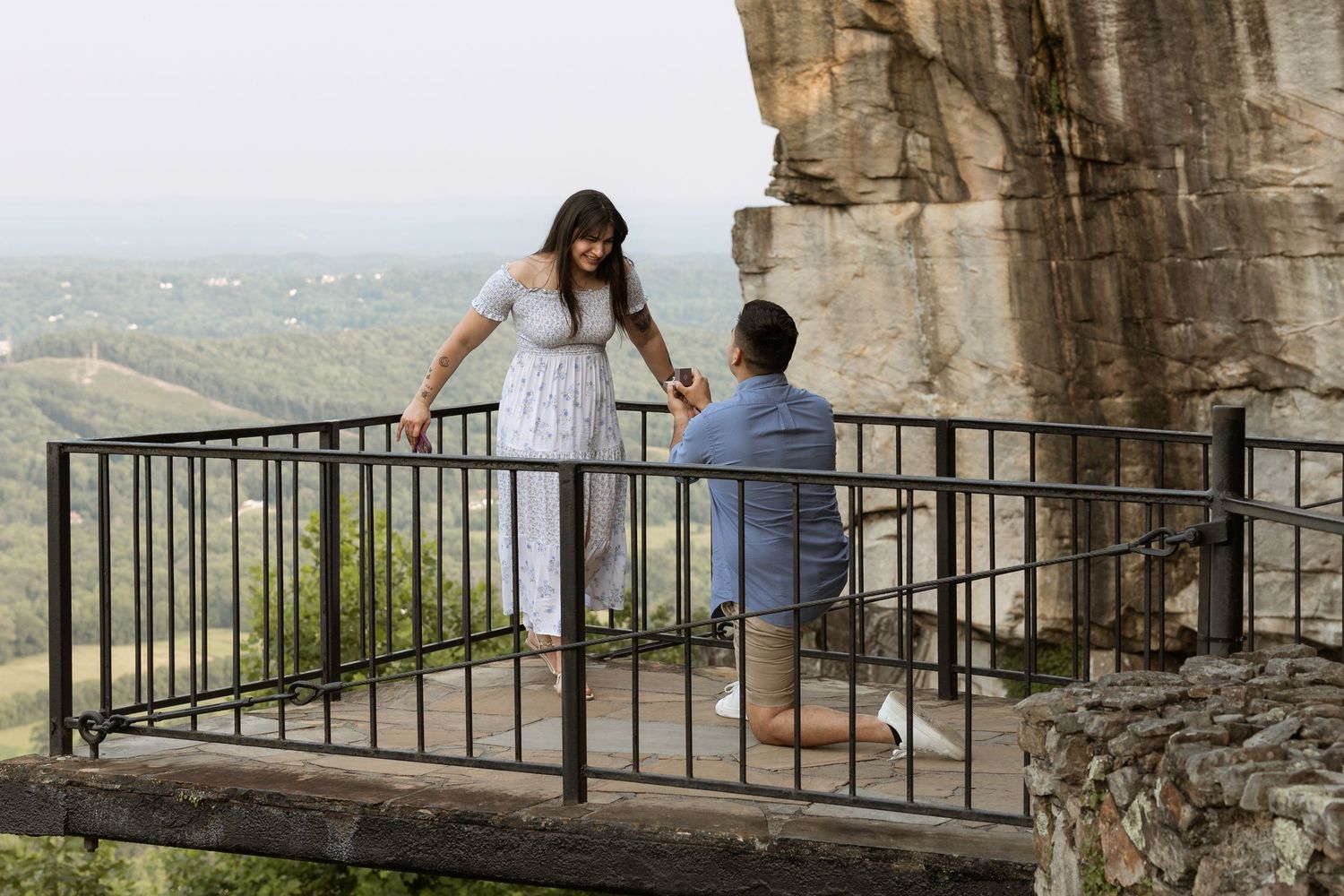 Couple during surprise proposal at Rock City Lover’s Leap Lookout Mountain GA
