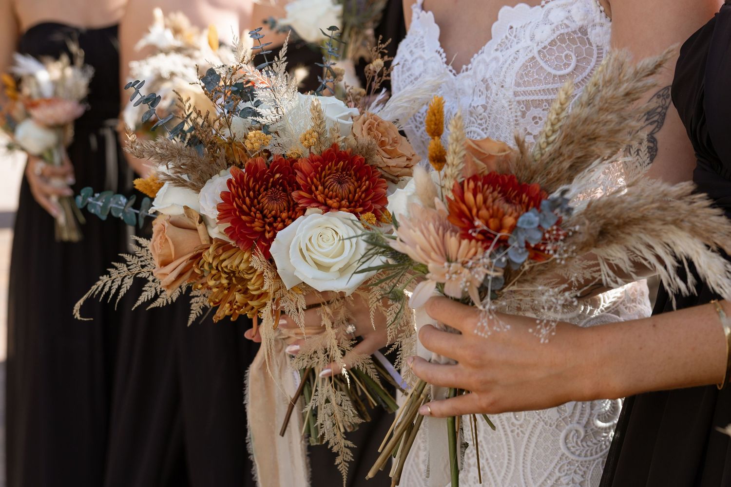 Bride carrying bouquet with turquoise florals at Taylor Estate wedding in Rome GA