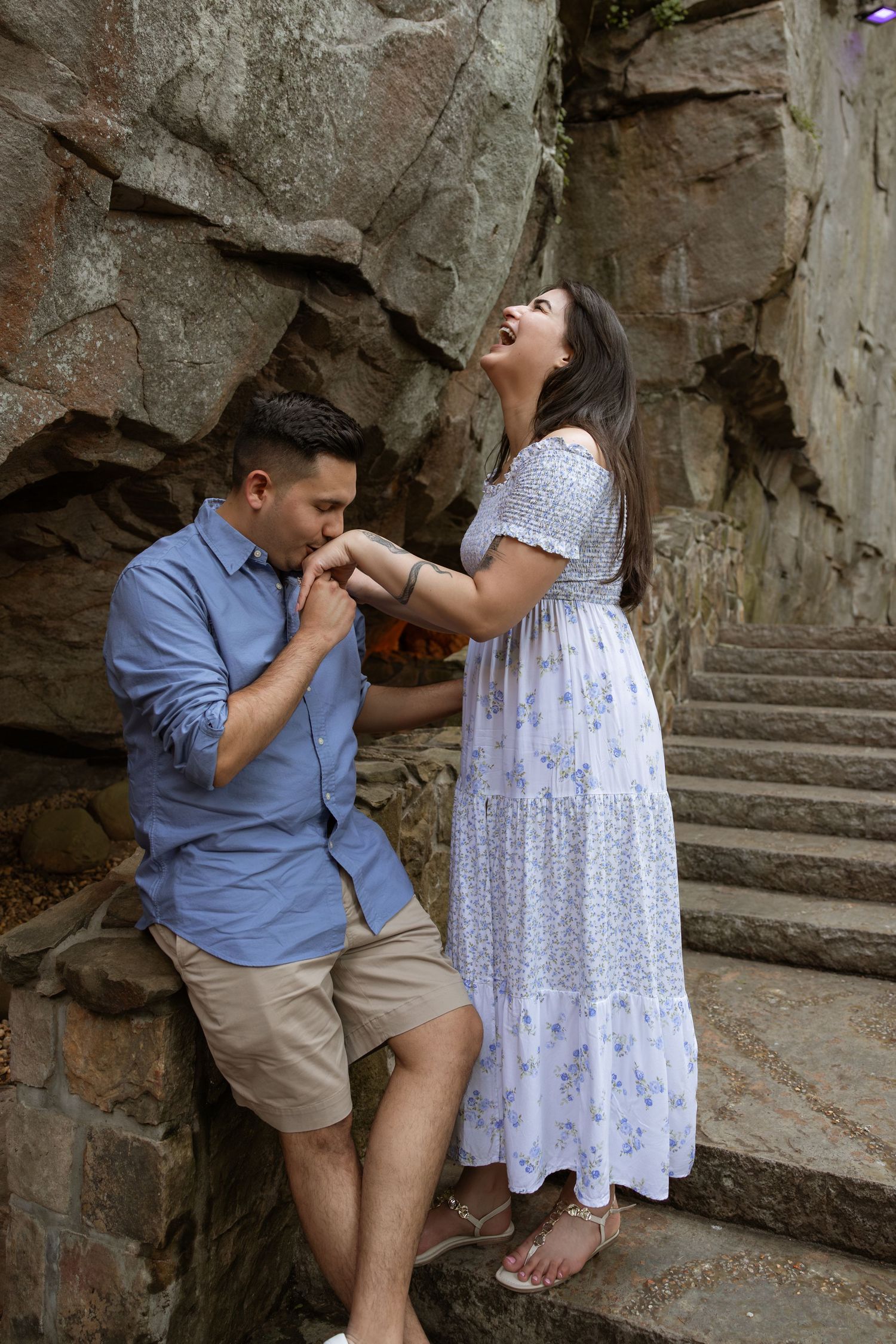 Candid engagement photography at Rock City proposal overlook in North Georgia