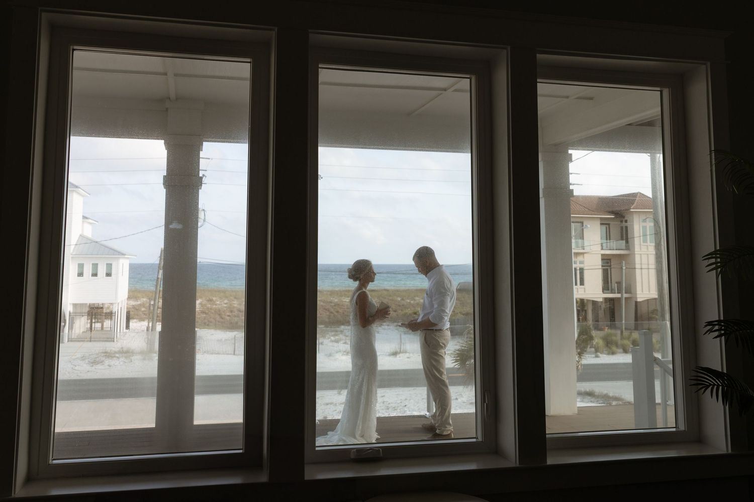 Couple exchanging vows at Navarre Beach micro wedding with ocean view