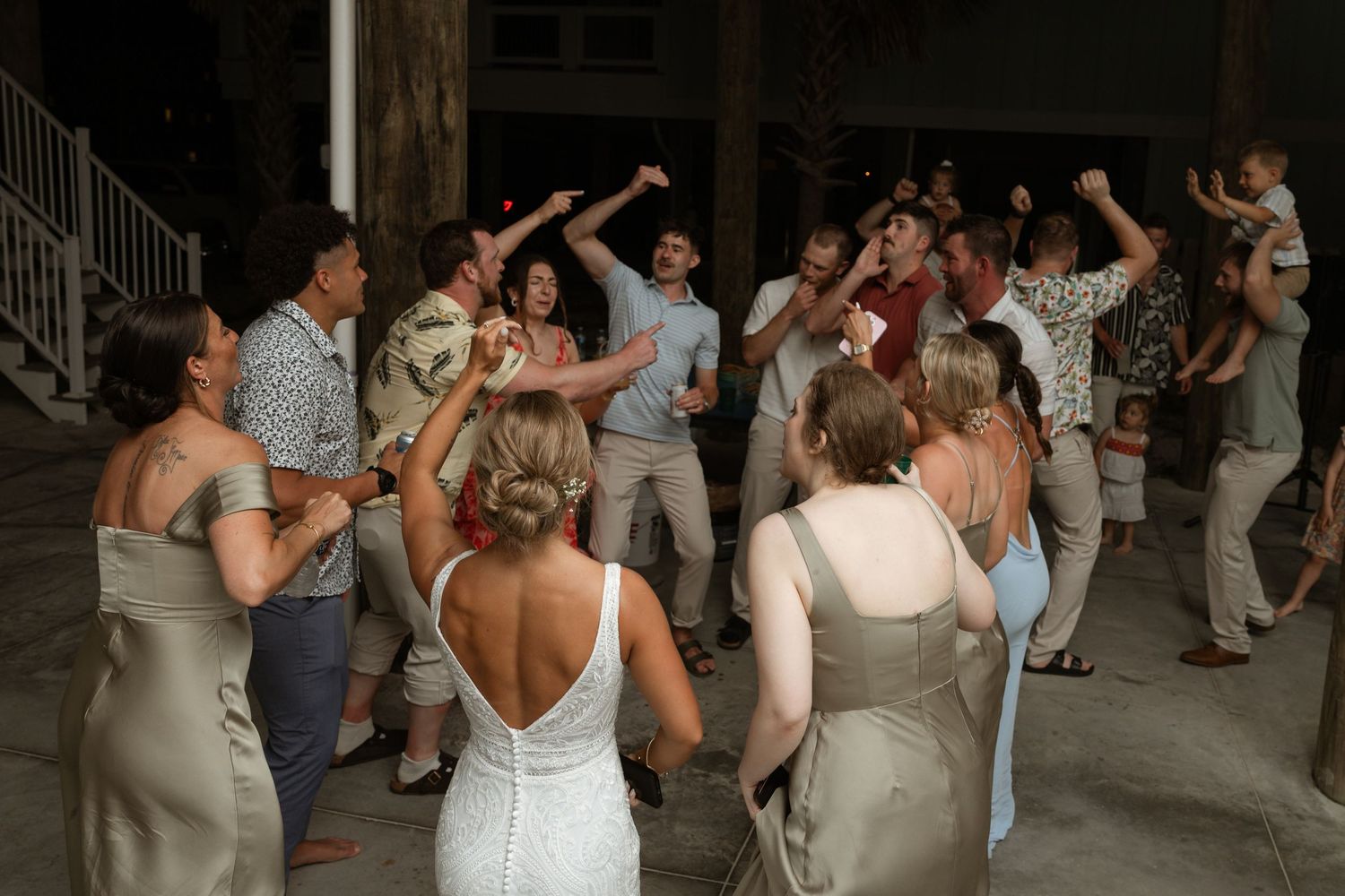 Guests celebrating at a beachside wedding reception in Navarre Beach FL