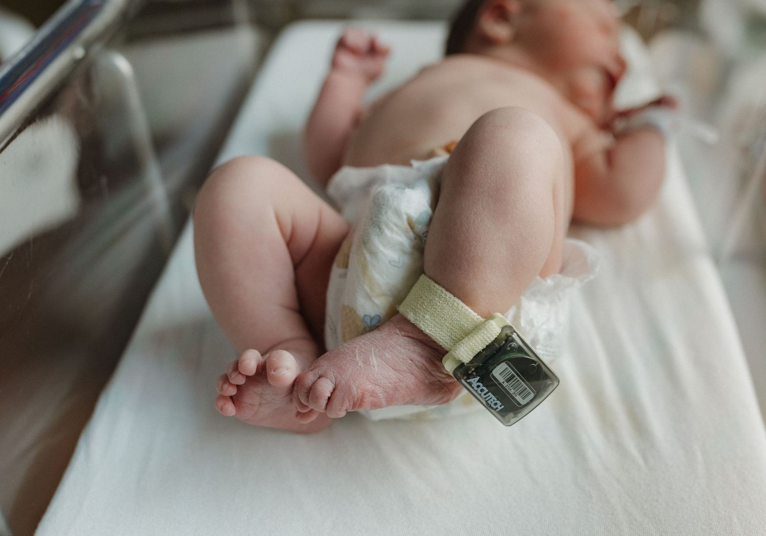 a newborn baby is curious and looking around during his fresh 48 session