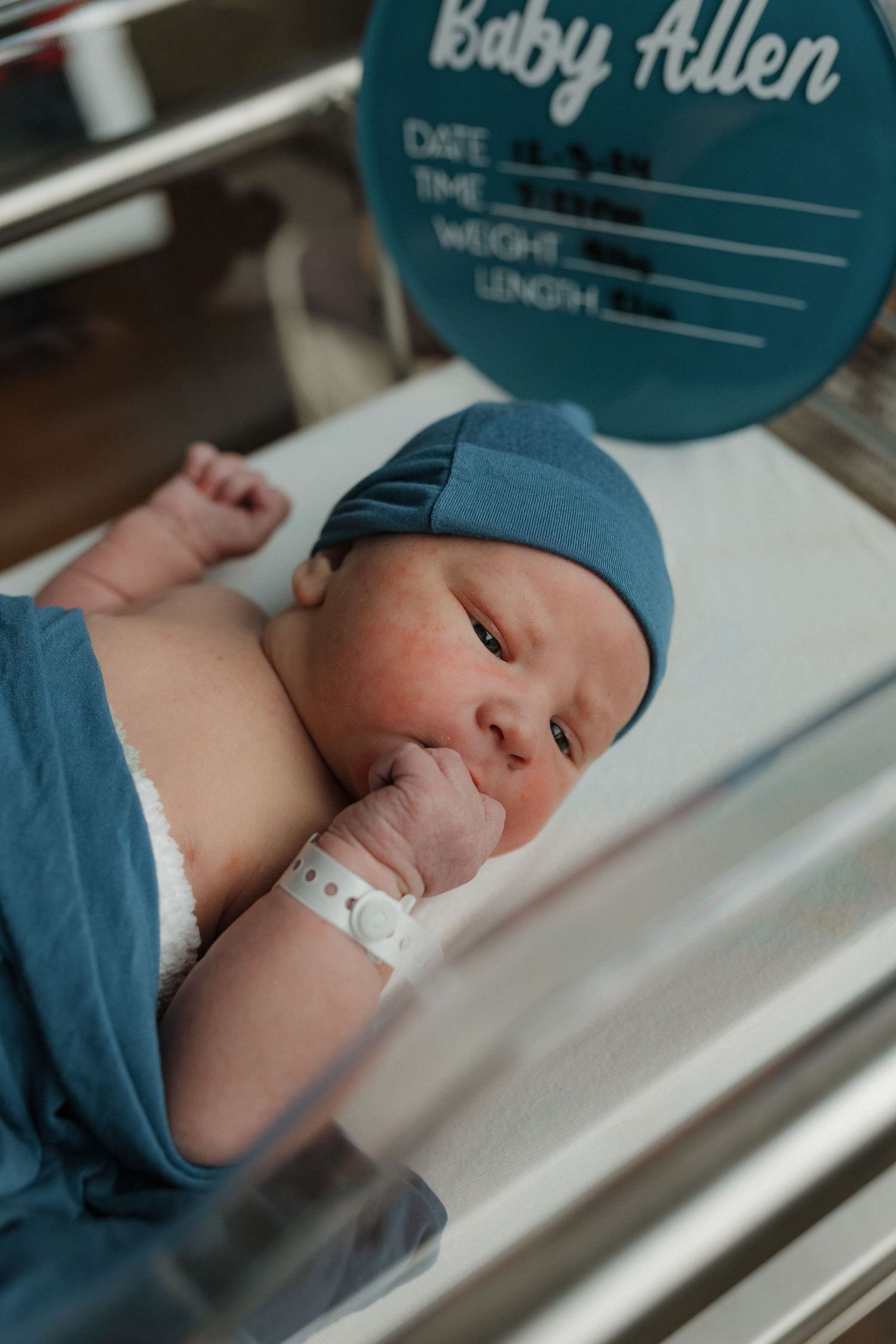 a newborn baby is curious and looking around during his fresh 48 session
