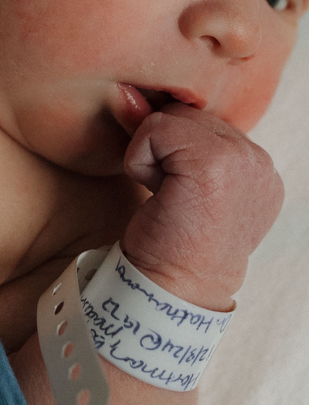 a newborn baby is curious and looking around during his fresh 48 session