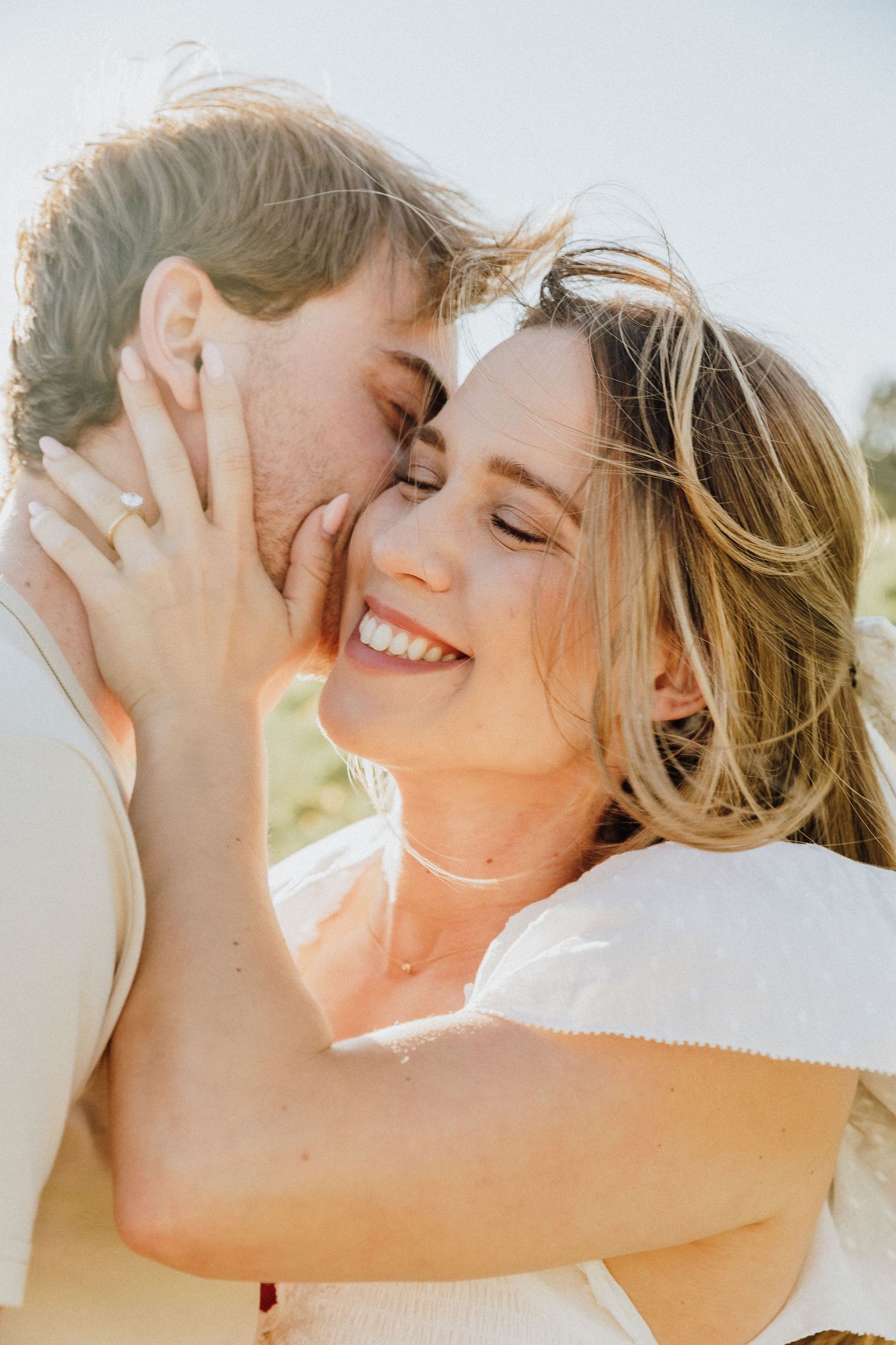Sun-kissed romantic moment captured during golden hour outdoors.