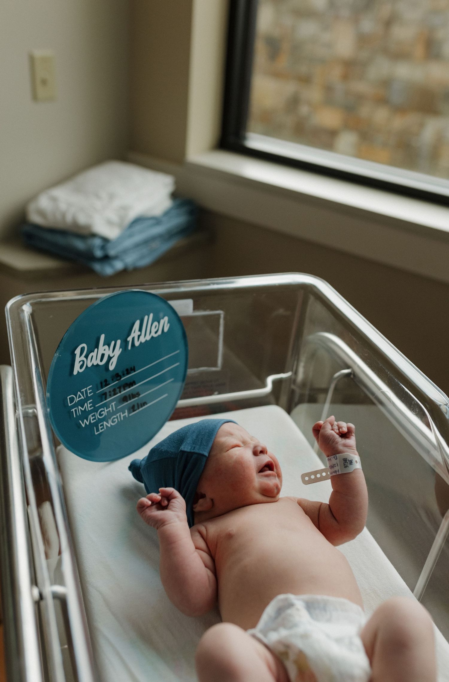 a newborn baby is curious and looking around during his fresh 48 session