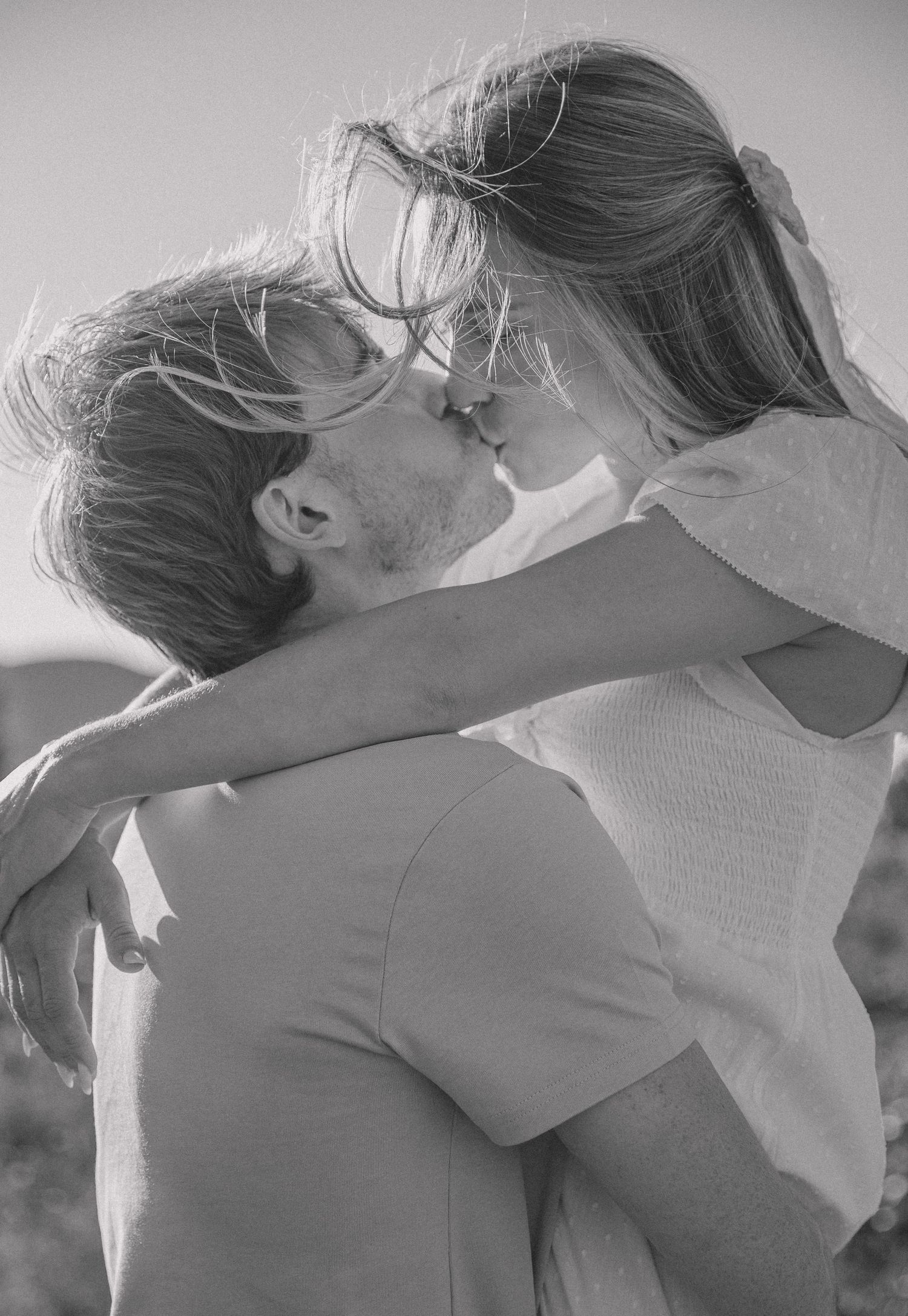 Black and white intimate portrait of a tender embrace.