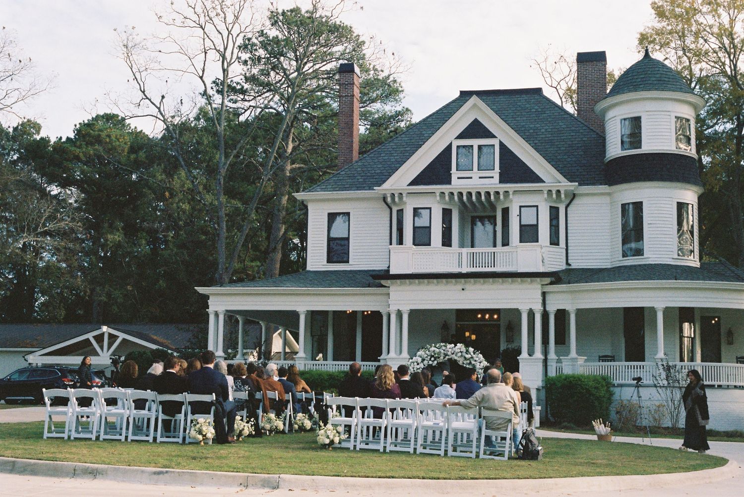 Panoramic view of the Carolina Manor House with outdoor seating setup.