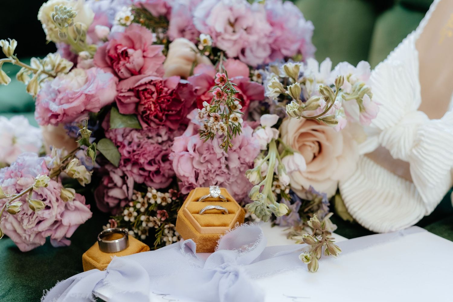 Romantic pink and blush floral arrangement with roses and delicate blooms.