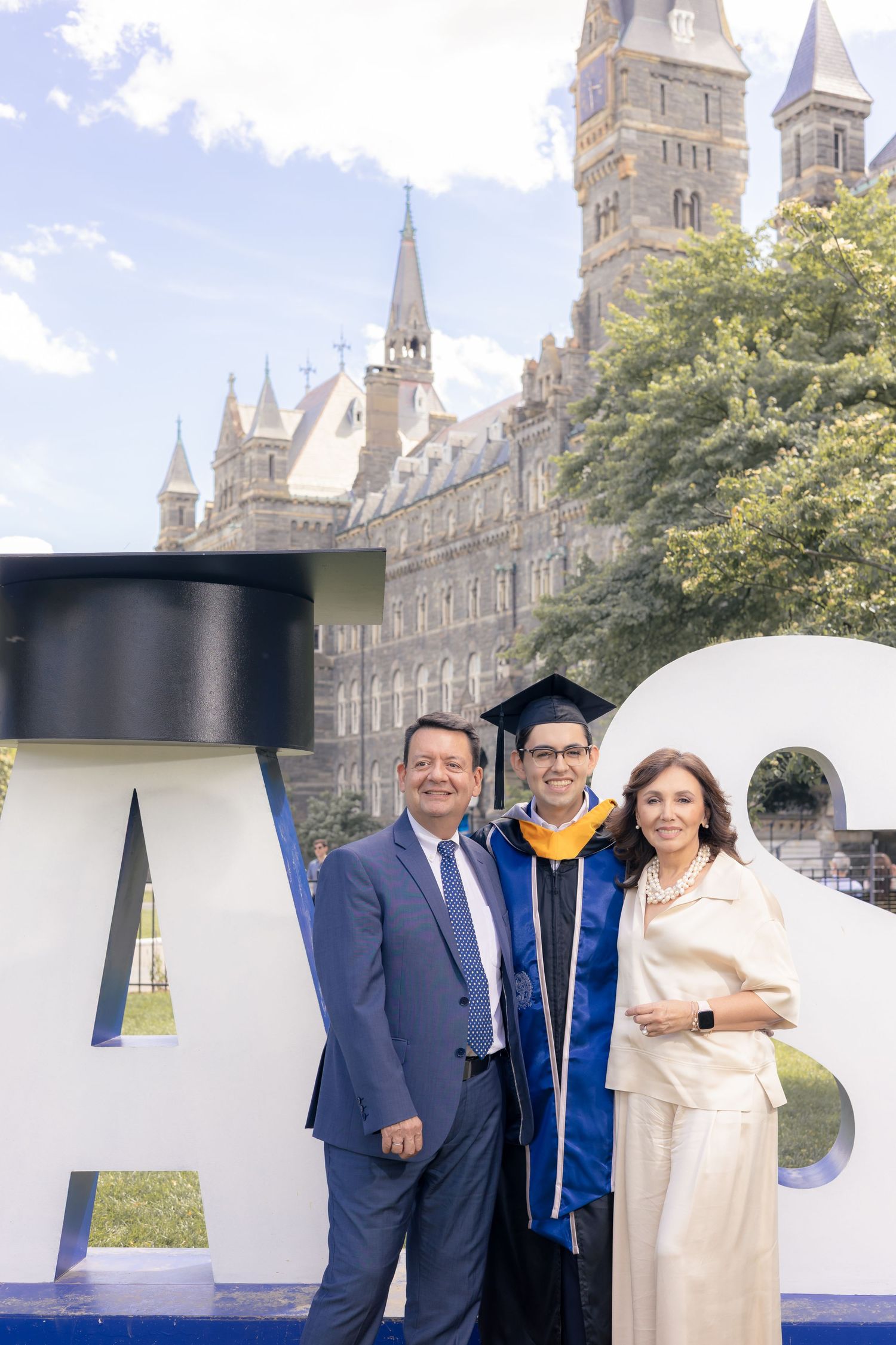 A collage of graduation photos with a family posing in front of a historic Georgian-style university building.