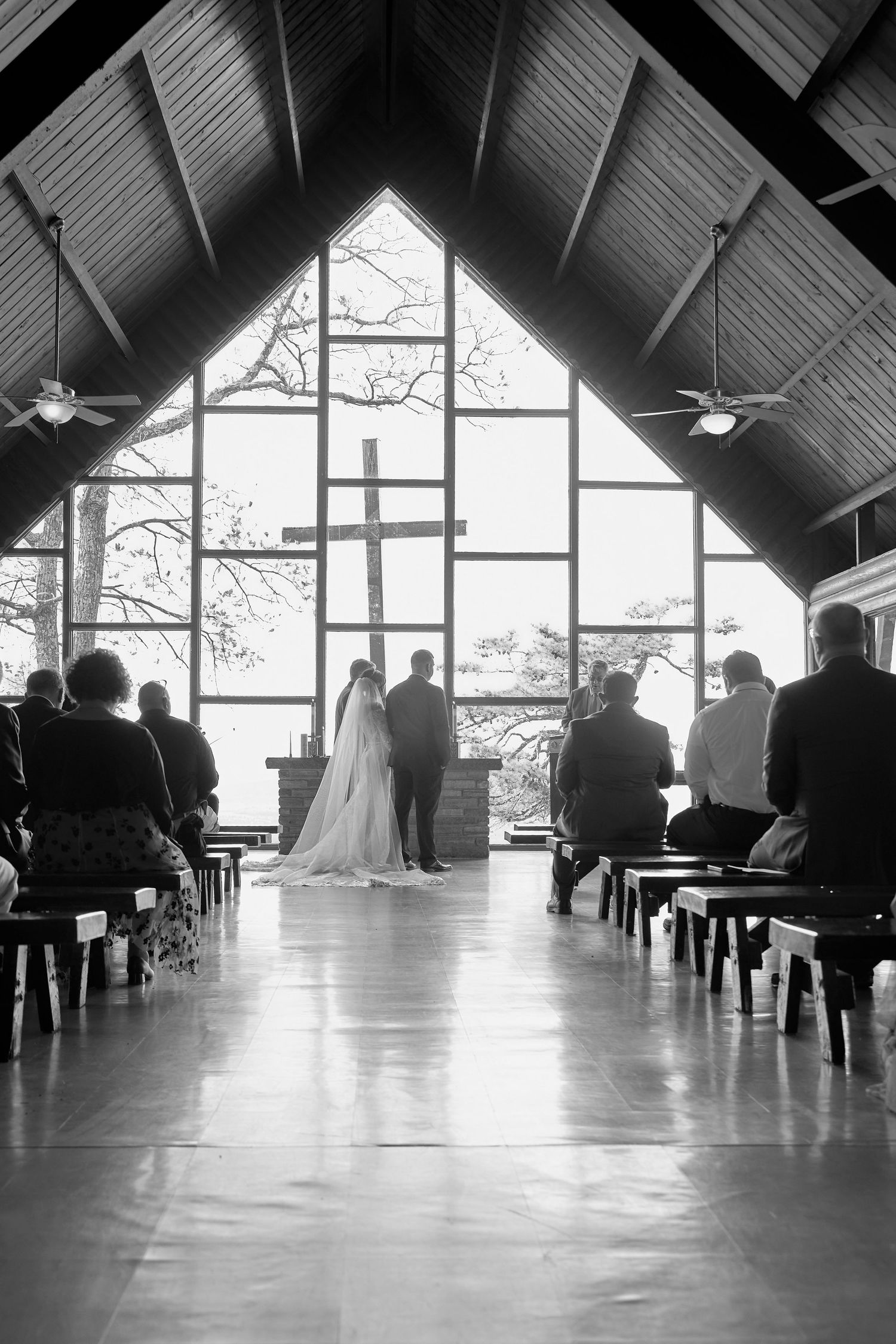 Interior view of a modern chapel with high vaulted ceilings and large windows letting in natural light.