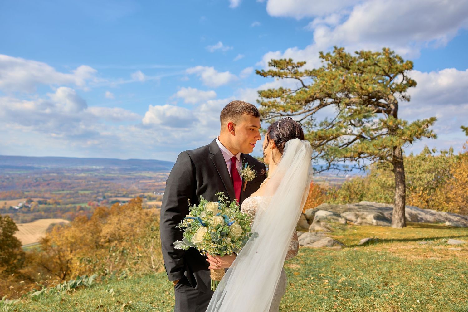 Scenic mountain landscape with blue skies and autumn foliage creating a natural backdrop.