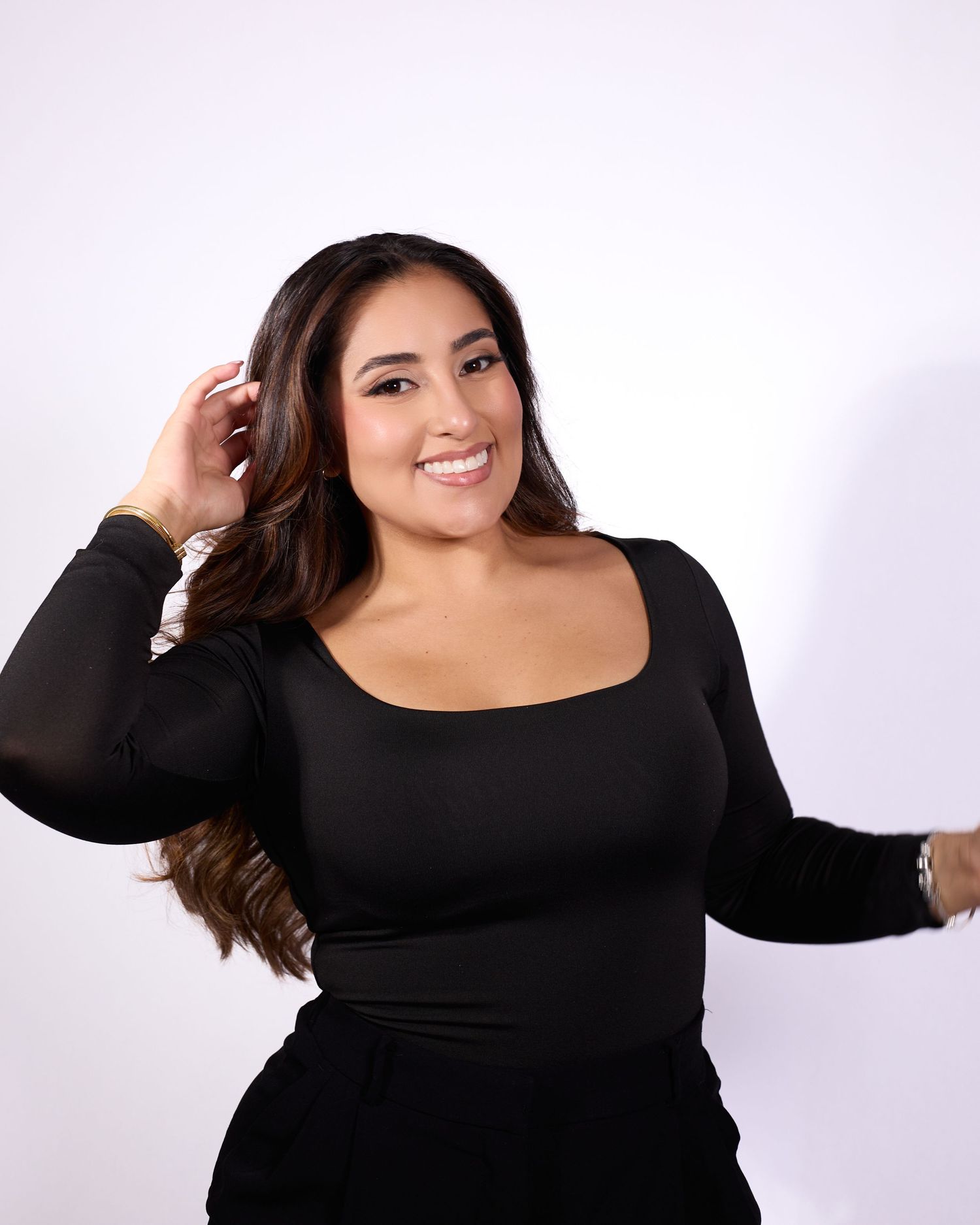 A series of fashion portraits showing someone posing in a black long-sleeved dress against a white background.