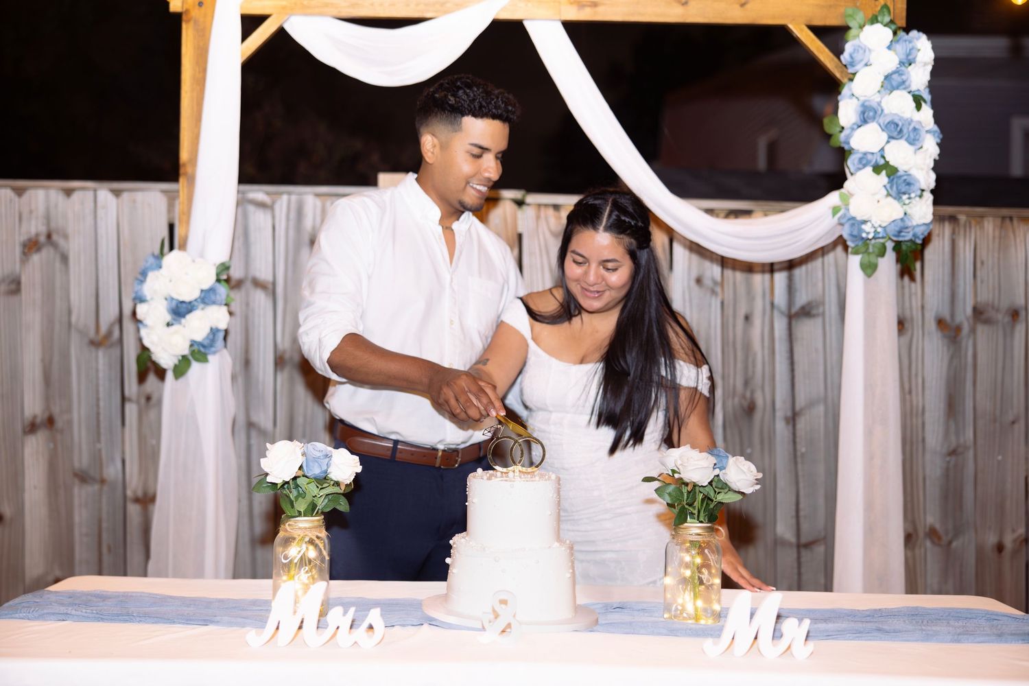 A collage of wedding photos showing a couple signing documents and embracing at an outdoor venue with white decorations.
