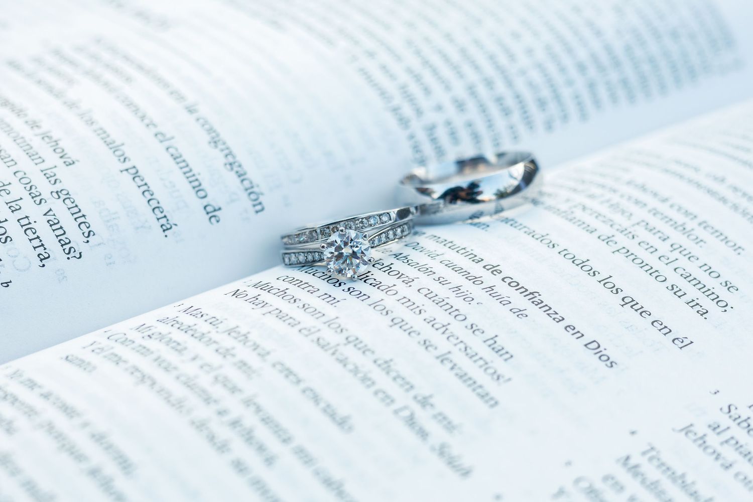 A close-up view of an open book with pages spread out showing printed text.