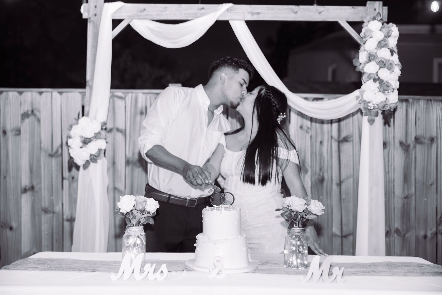 Black and white wedding photo collage showing reception details, decorations and dance floor moments.