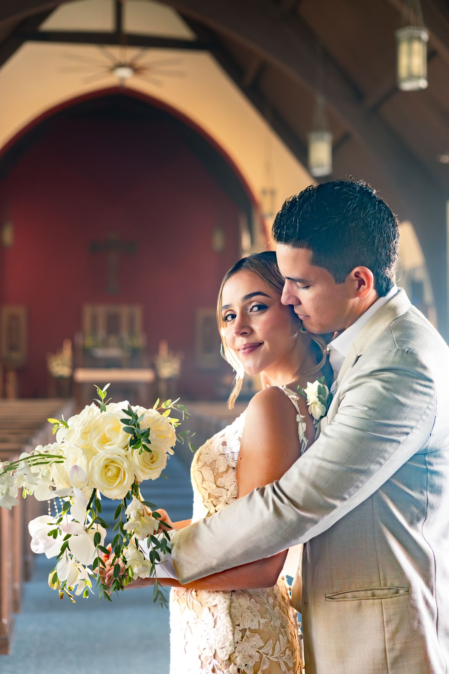 A romantic wedding photo sequence showing a couple embracing while holding a white and yellow floral bouquet.
