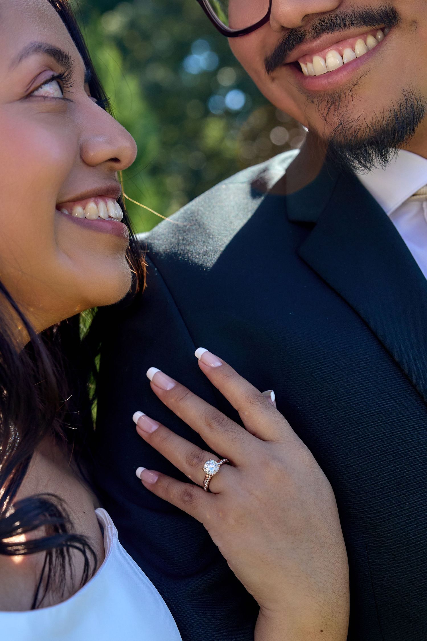 A close-up series of engagement photos showing a couple embracing and displaying a diamond ring.